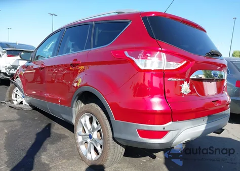 2014 Ford Escape Titanium z USA, uszkodzony, nr VIN 1FMCU0J99EUC85291